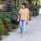 Mom is carrying the Baby Trend EZ-Lift PRO Infant Car Seat with the ez-side grip