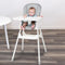 A child is sitting in the Baby Trend Adapt 4-in-1 High Chair