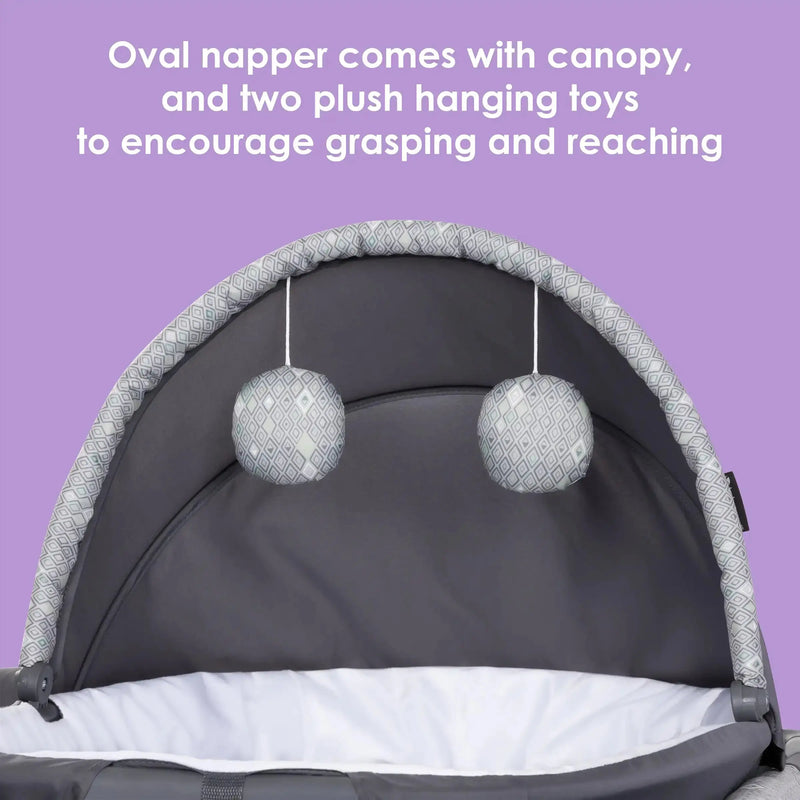 Baby Trend Nursery Suite Playard with Portable Cradle oval napper comes with canopy and two plush hanging toys