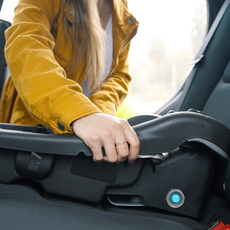 Mom is installing the Baby Trend EZ-Lift PLUS Infant Car Seat