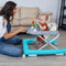 Mom is watching over her child while he plays in the Smart Steps by Baby Trend Trend Activity Walker