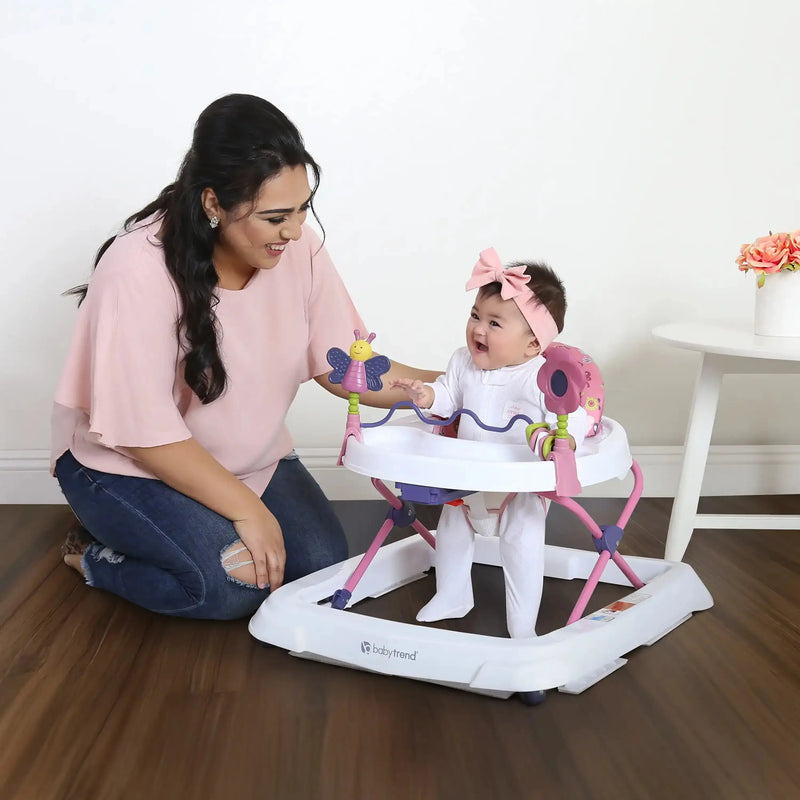 A mom and her child with the Baby Trend Trend Walker