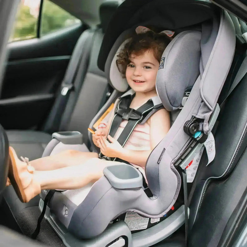 A toddler is sitting in the front facing position with the Baby Trend Cover Me Convertible Car Seat