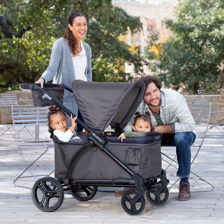 Baby Trend Expedition 2-in-1 Stroller Wagon with family of 4 including twins