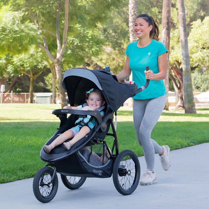 Baby Trend Expedition Race Tec Plus Jogger mother taking a stroll with her child