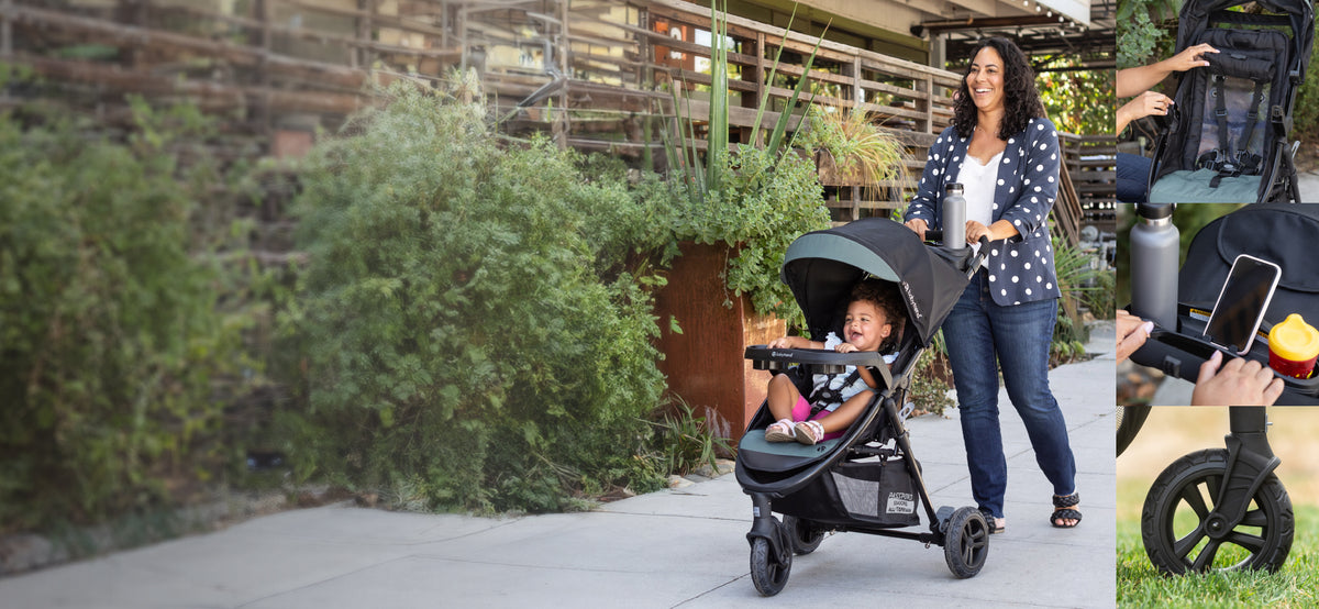 A mom is pushing her child in the Baby Trend Passport Seasons All-Terrain Stroller