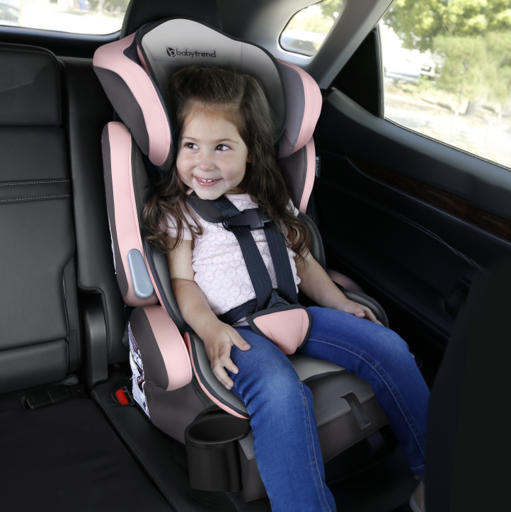 Baby smiling in car seat in back seat of car