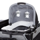 Load image into gallery viewer, Baby Trend Simply Smart Nursery Center removable rock-a-bye bassinet with two hanging toys