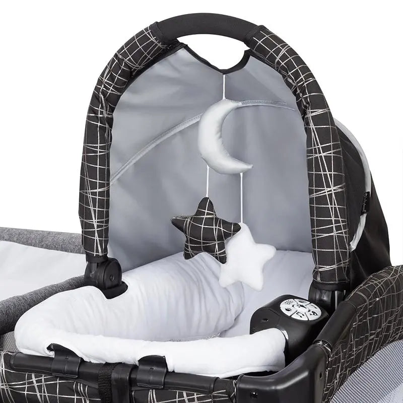 Baby Trend GoLite ELX Nursery Center Playard with removable rock-a-bye bassinet and two hanging toys