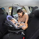Load image into gallery viewer, Mom is looking at her child sitting on Baby Trend EZ-Lift PRO Infant Car Seat in the car
