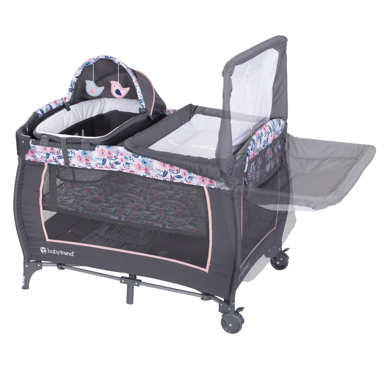 Flip away changing table is included with the Baby Trend Lil' Snooze Deluxe II Nursery Center Playard