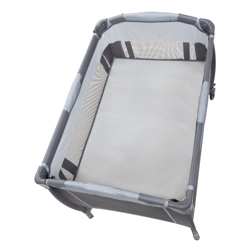 Baby Trend Lil’ Snooze Deluxe III Nursery Center Playard for Twins includes full-size bassinet