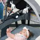 Load image into gallery viewer, Baby laying in the Baby Trend Deluxe II Nursery Center Playard with mom watching her child