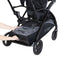 Large storage basket with rear basket access from the Baby Trend Sit N Stand 5-in-1 Shopper Stroller
