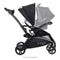 Side view of the Baby Trend Sit N Stand 5-in-1 Shopper Stroller with infant car seat on the child's seat, sold separately