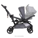 Load image into gallery viewer, Side view of the Baby Trend Sit N' Stand Double 2.0 Stroller with an infant car seat in the front and rear as a jump seat