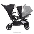 Load image into gallery viewer, Side view of the Baby Trend Sit N' Stand Double 2.0 Stroller with infant car seat in front seat, infant car seat sold separately
