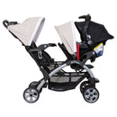 Load image into gallery viewer, Baby Trend Sit N' Stand Double Stroller side view of the rear seat and front seat holding an infant car seat