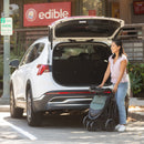 Load image into gallery viewer, A mother folded the stroller to put in her car