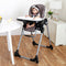 Toddler girl sitting at the dinning table in the Baby Trend A La Mode Snap Gear 5-in-1 High Chair